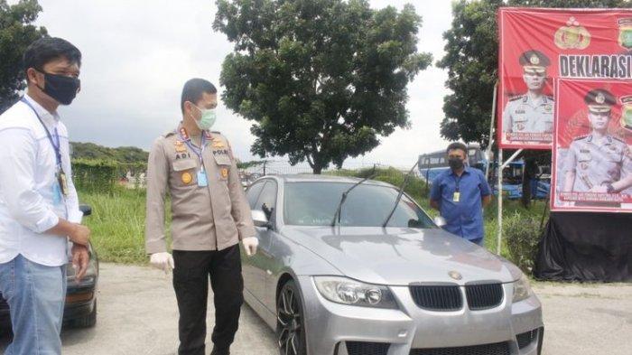 mobil bmw yang terparkir lebih dari setahun di bandara soekarno hatta